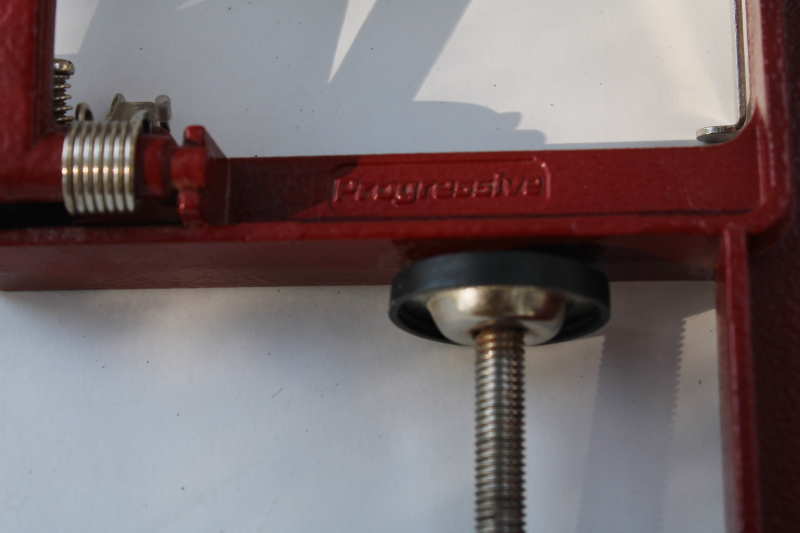 photo of old fashioned red metal hand crank apple peeler, vintage style kitchen tool #4