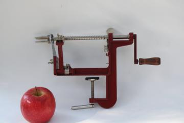 catalog photo of old fashioned red metal hand crank apple peeler, vintage style kitchen tool