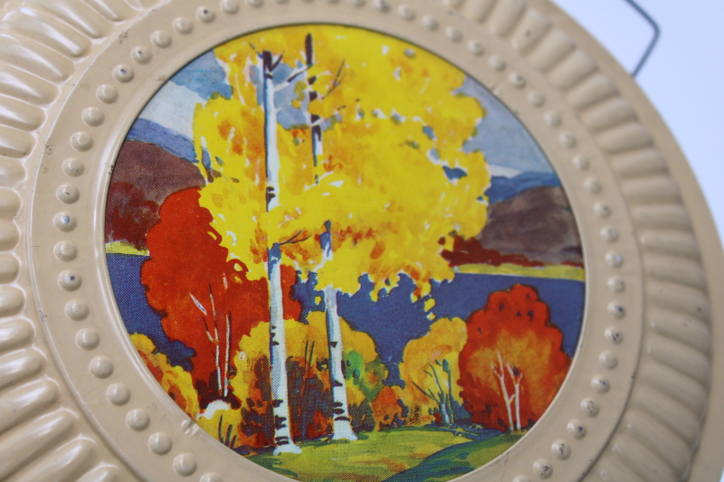 photo of old fashioned tin flue cover for chimney stove pipe, vintage metal plate w/ autumn trees scene #3