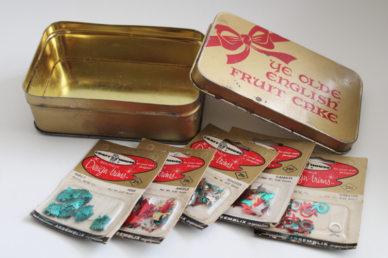 photo of old fruitcake tin w/ packages of sequins for Christmas decorations or beaded ornaments #1