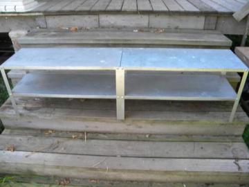 catalog photo of old galvanized steel shelves for kitchen pantry or studio workshop