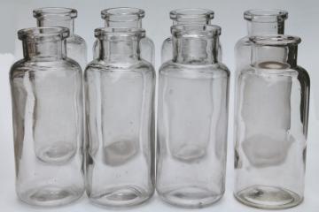 catalog photo of old glass apothecary bottles, vintage clear glass jars, tall canister bottle lot