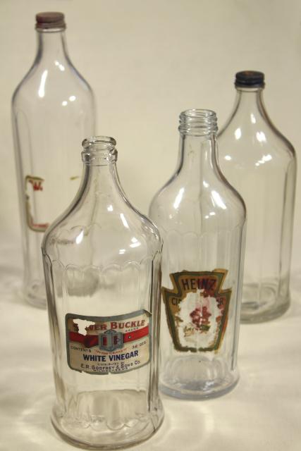 photo of old glass bottles, large vinegar bottle lot w/ some original paper labels #1