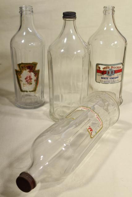 photo of old glass bottles, large vinegar bottle lot w/ some original paper labels #7