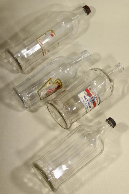 photo of old glass bottles, large vinegar bottle lot w/ some original paper labels #8