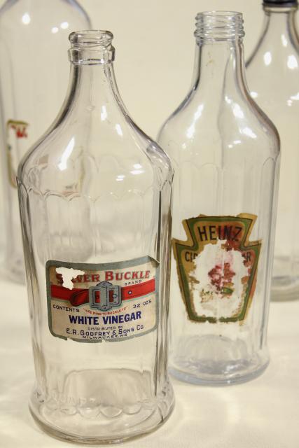 photo of old glass bottles, large vinegar bottle lot w/ some original paper labels #9