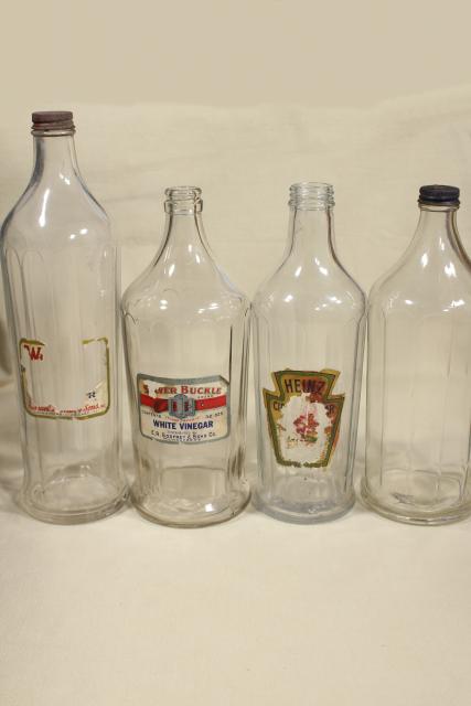 photo of old glass bottles, large vinegar bottle lot w/ some original paper labels #10