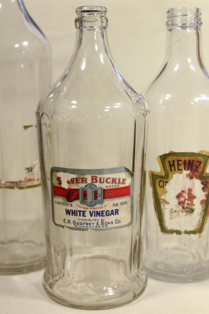 photo of old glass bottles, large vinegar bottle lot w/ some original paper labels #11