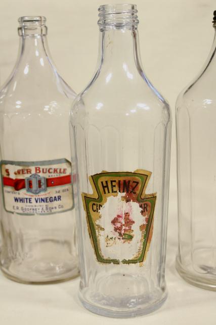 photo of old glass bottles, large vinegar bottle lot w/ some original paper labels #13