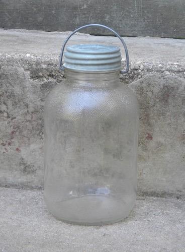 photo of old glass honey jars w/metal caps and wire handles for pantry storage #2