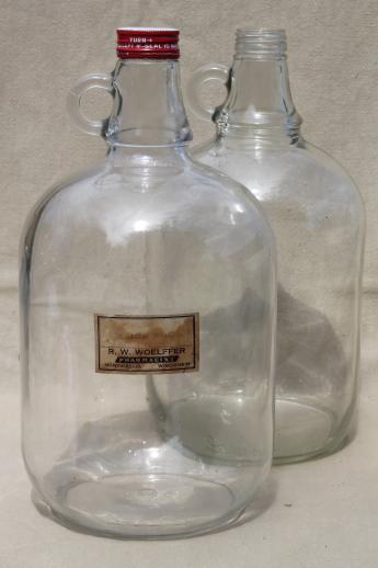 photo of old glass jugs, gallon & half-gallon jug bottles one w/ coca-cola syrup label #3