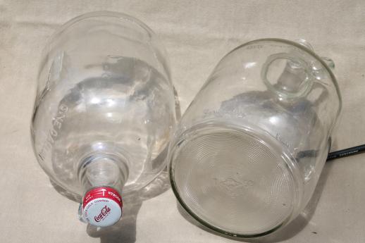 photo of old glass jugs, gallon & half-gallon jug bottles one w/ coca-cola syrup label #5