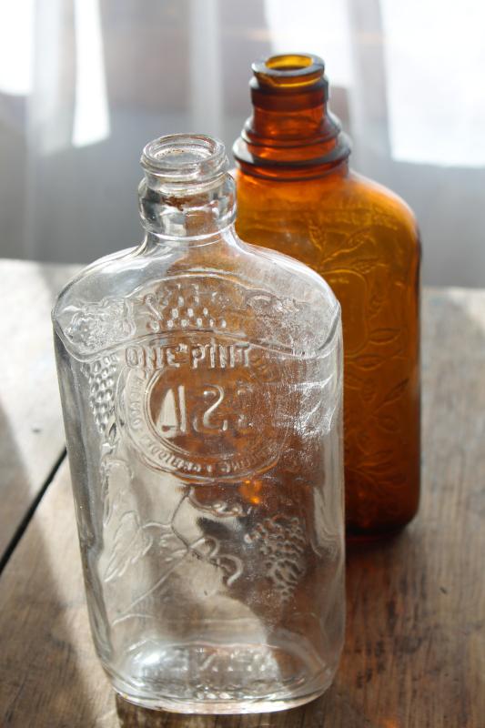 photo of old glass liquor bottles, fancy embossed pattern glass wine & whiskey bottle flasks #5