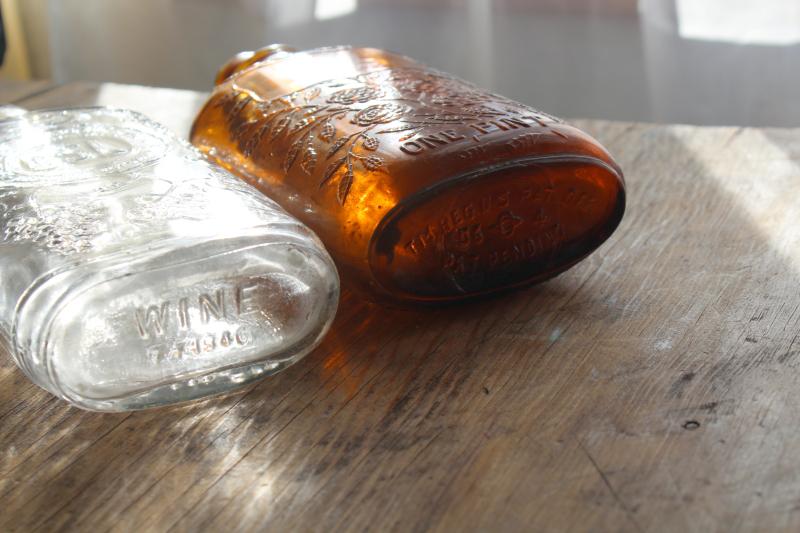 photo of old glass liquor bottles, fancy embossed pattern glass wine & whiskey bottle flasks #7