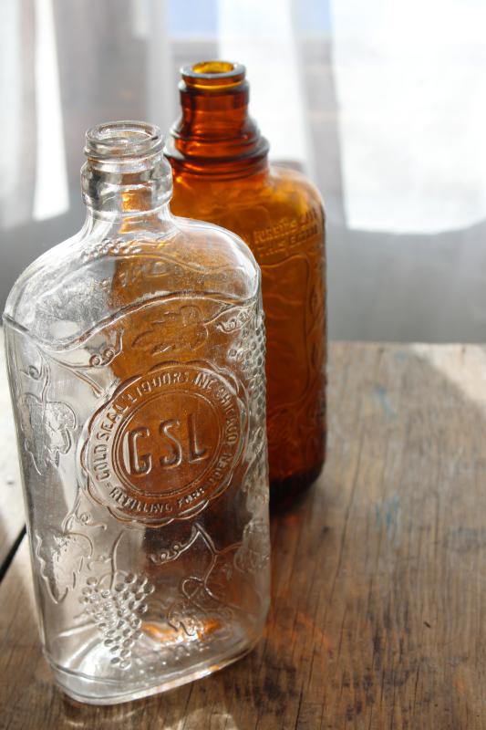 photo of old glass liquor bottles, fancy embossed pattern glass wine & whiskey bottle flasks #9