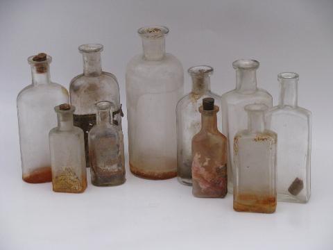 photo of old glass medicine bottle lot, antique vintage bottles as found #1