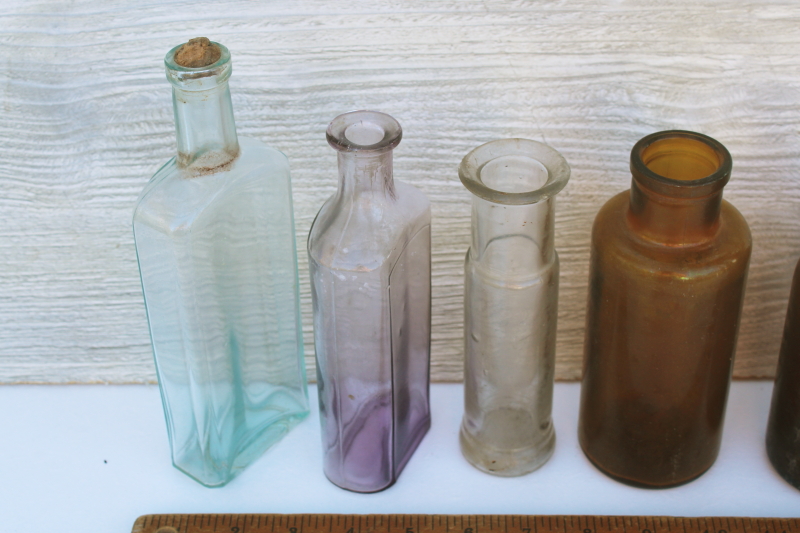 photo of old glass medicine bottles, amber brown, aqua, lavender tint clear glass vintage bottle lot #4