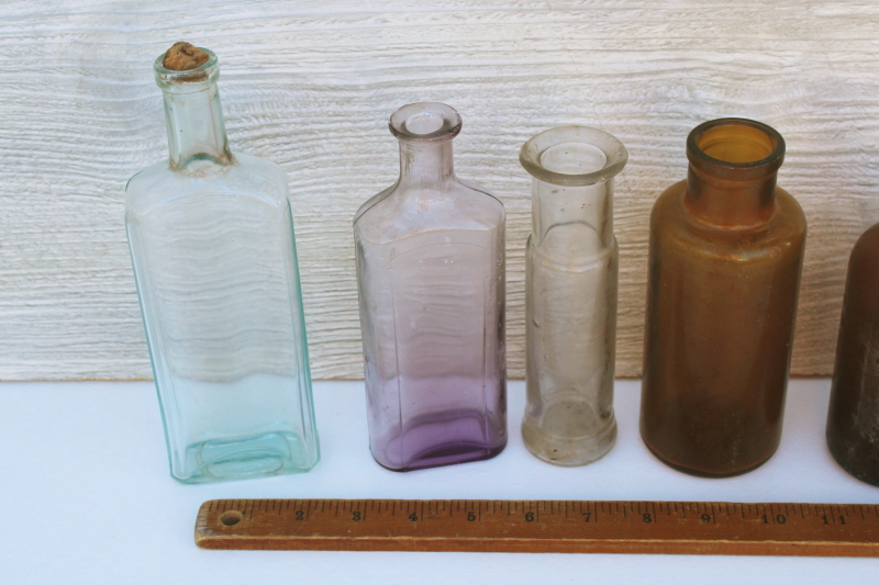 photo of old glass medicine bottles, amber brown, aqua, lavender tint clear glass vintage bottle lot #5