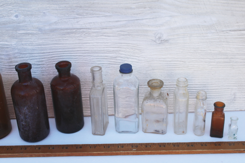 photo of old glass medicine bottles, amber brown, aqua, lavender tint clear glass vintage bottle lot #6