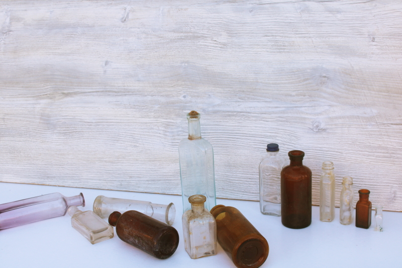 photo of old glass medicine bottles, amber brown, aqua, lavender tint clear glass vintage bottle lot #8