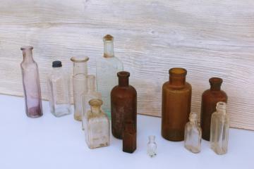 catalog photo of old glass medicine bottles, amber brown, aqua, lavender tint clear glass vintage bottle lot