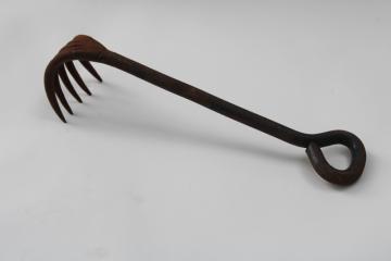 catalog photo of old hand forged iron rake, heavy claw for fireplace or wood stove, primitive vintage hand tool