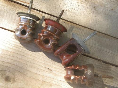 photo of old industrial vintage brown ceramic screw base architectural insulators #1