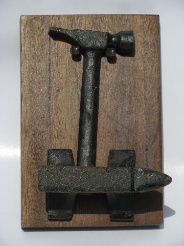 photo of old iron anvil and small hammer, vintage nut cracker #1