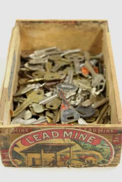 catalog photo of old key lot, old cigar box full of vintage keys, car keys, house latch keys etc