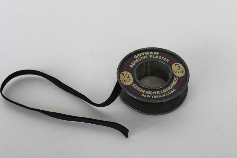 photo of old metal spool from Gotham Labs sticking plaster bandage roll, vintage medical advertising #1