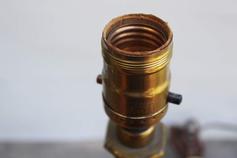 photo of old ornate cast metal candlestick lamp w/ antique brass finish, early electric Aladdin label light #4