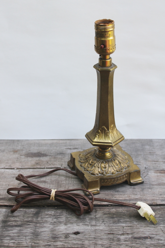 photo of old ornate cast metal candlestick lamp w/ antique brass finish, early electric Aladdin label light #8