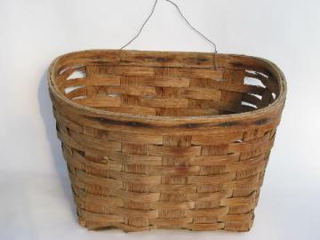 catalog photo of old primitive oak wood splint basket, hanging wall pocket