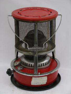 catalog photo of old red enamel kerosene camp heater, vintage camping gear