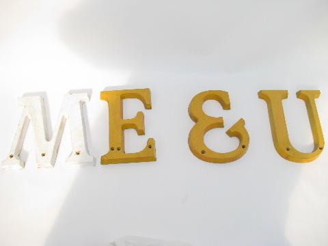 photo of old vintage store sign letters spelling out ME & U #1