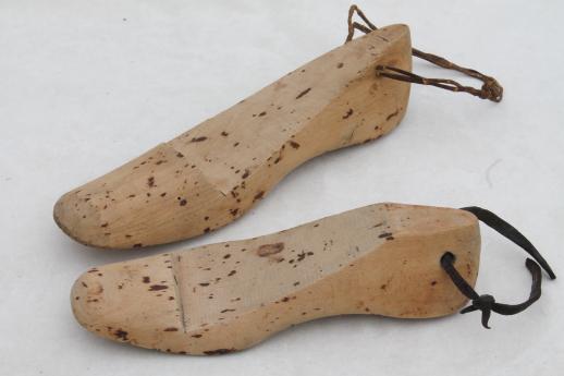 photo of old wooden feet, foot shaped wood blocks to form shoes or slippers, vintage shoe stretchers #1