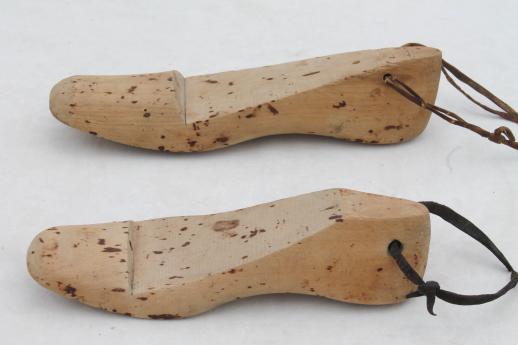 photo of old wooden feet, foot shaped wood blocks to form shoes or slippers, vintage shoe stretchers #9