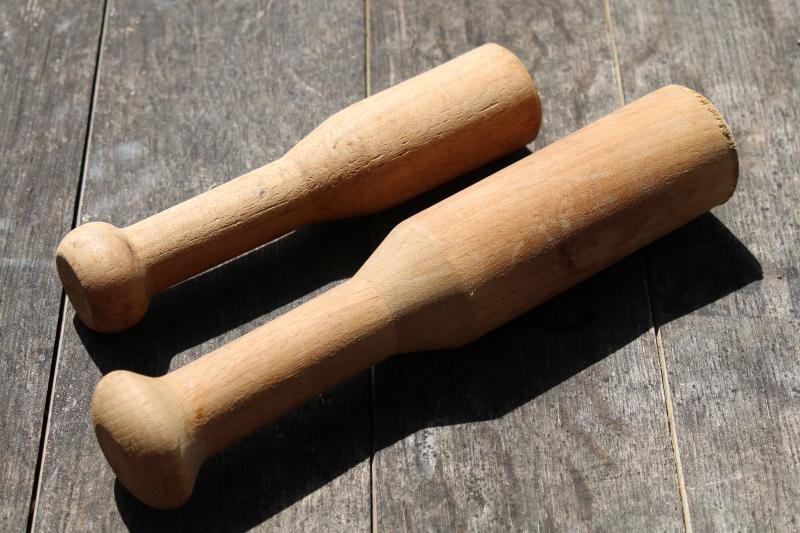 photo of old wooden pestles or small mashers, rustic primitive natural wood utensils #1