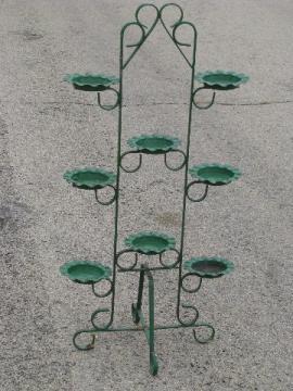 catalog photo of old wrought iron plant stand to hold candles, flowers, floor displays