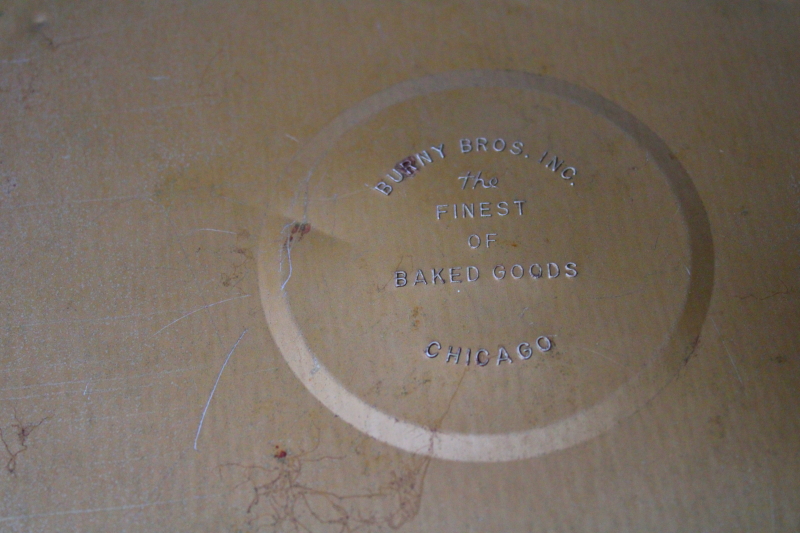 photo of ornamental vintage bakery tin lid, large round w/ embossed leather look paper, wall art or flue cover #4