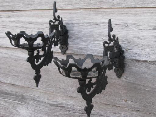 photo of ornate oil lamp holder wall brackets, vintage cast metal marked Emig #1