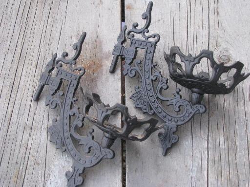 photo of ornate oil lamp holder wall brackets, vintage cast metal marked Emig #4