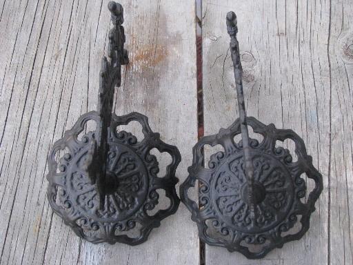 photo of ornate oil lamp holder wall brackets, vintage cast metal marked Emig #5