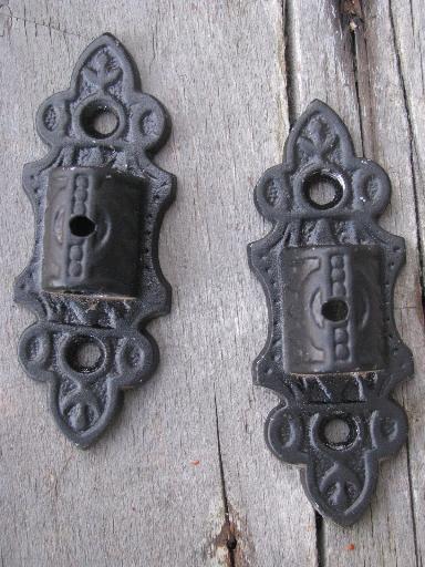 photo of ornate oil lamp holder wall brackets, vintage cast metal marked Emig #6