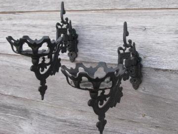 catalog photo of ornate oil lamp holder wall brackets, vintage cast metal marked Emig