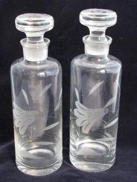 catalog photo of pair glass decanter bottles w/ ground stoppers, etched trumpet flowers