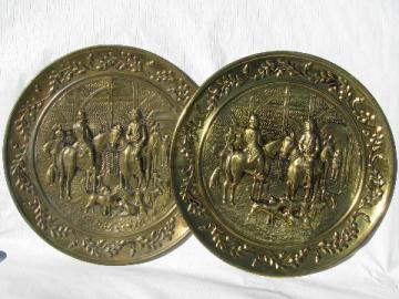 catalog photo of pair of embossed solid brass chargers, hunt scene pattern, vintage England