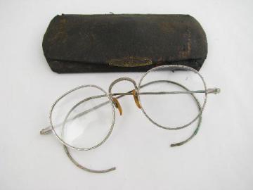 catalog photo of pair of old antique spectacles w/ornate frames & leatherette case