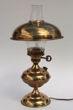 catalog photo of polished brass table or desk lamp w/ metal shade & glass chimney, old fashioned oil lamp