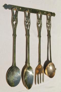 catalog photo of polished solid brass kitchen utensils w/ wall rack, large spoon & fork, skimmer, ladle